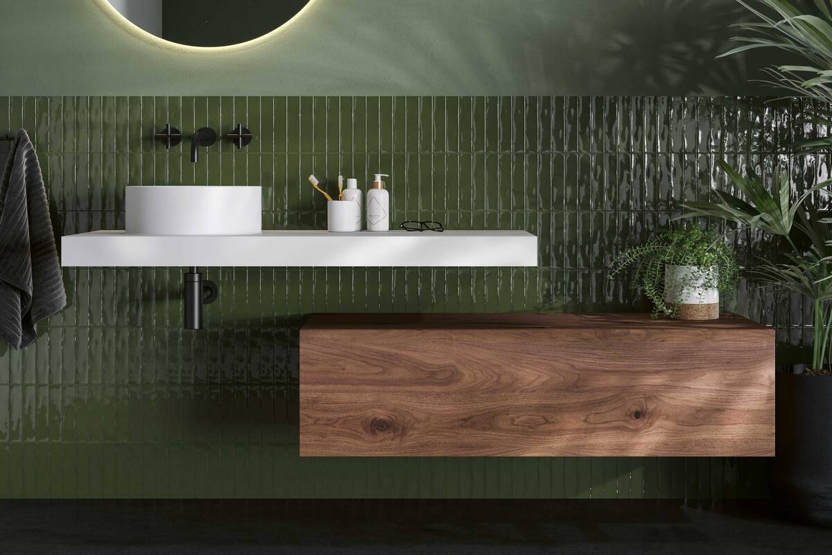 Der Mineralwerkstoff Corian des puristischen Aufsatzwaschbeckens «Sleek» überzeugt durch eine glatte, porenlose und pflegeleichte Oberfläche. Talsee AG.